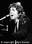 Paul singing at piano (image)